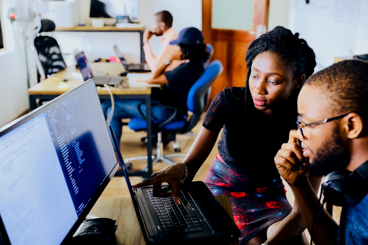 Two colleagues reviewing employee data together
