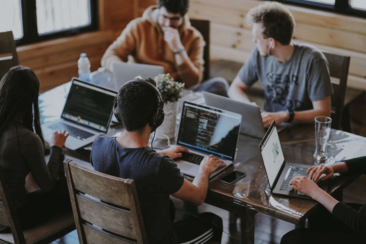 A people team working together around a shared table